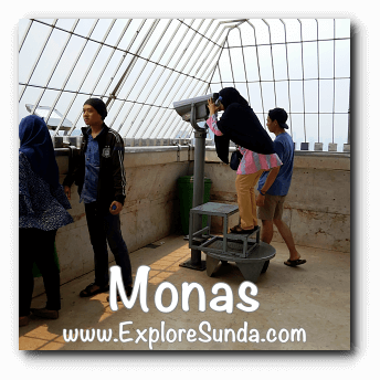 Use a telescope to see far away objects in the observation deck of Monas, Jakarta Use a telescope to see far away objects in the observation deck of Monas, Jakarta