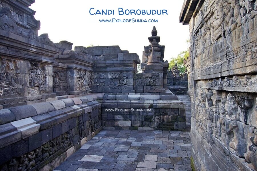 The corridors of Candi Borobudur are adorned with reliefs, and the floor is made of interlocked andesite stones.